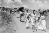 Palestinian women and children carry their belongings after being forced to leave their village near Haifa on June 26, 1948.